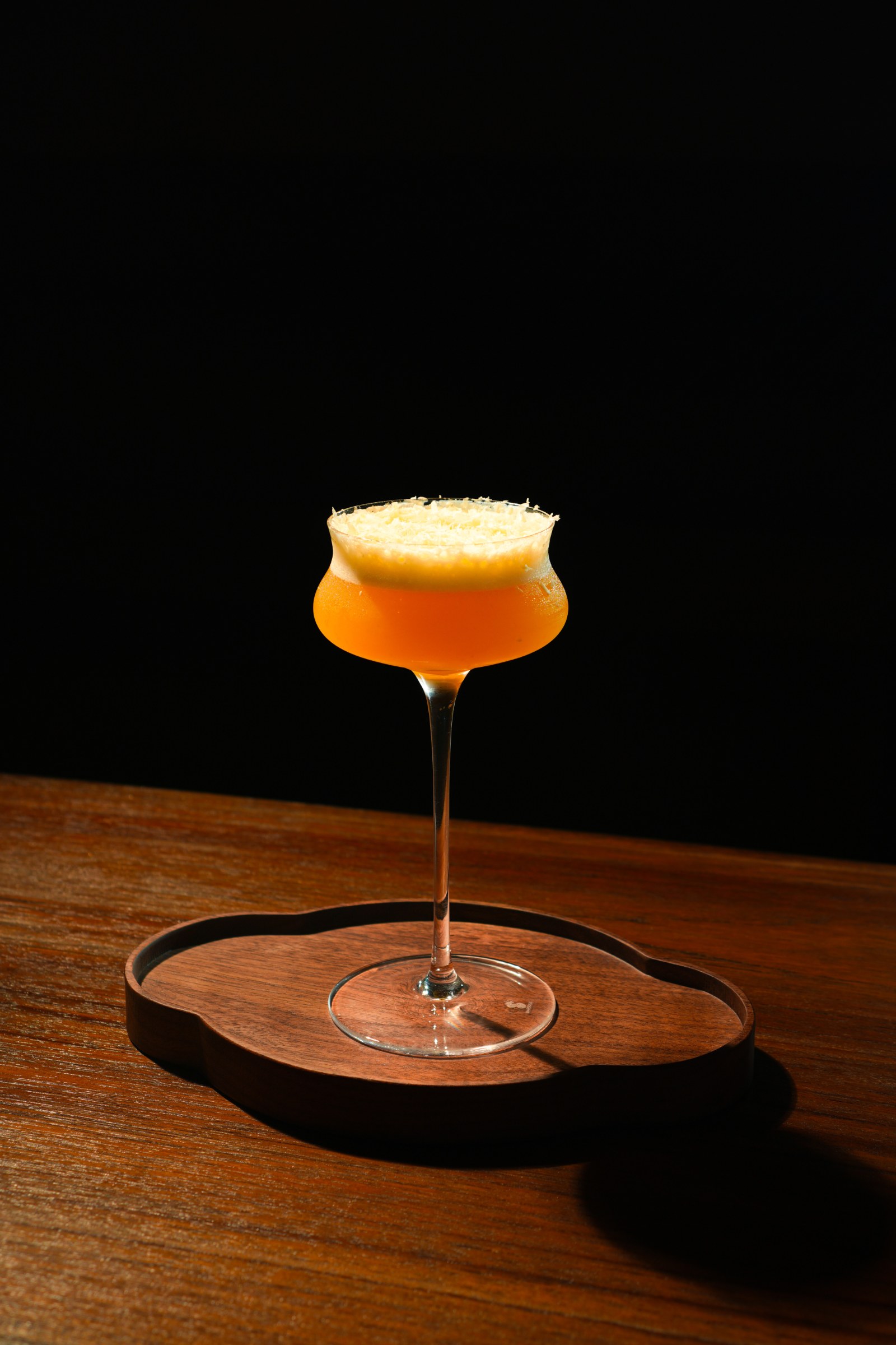 A signature cocktail being presented at Bar Rasa.