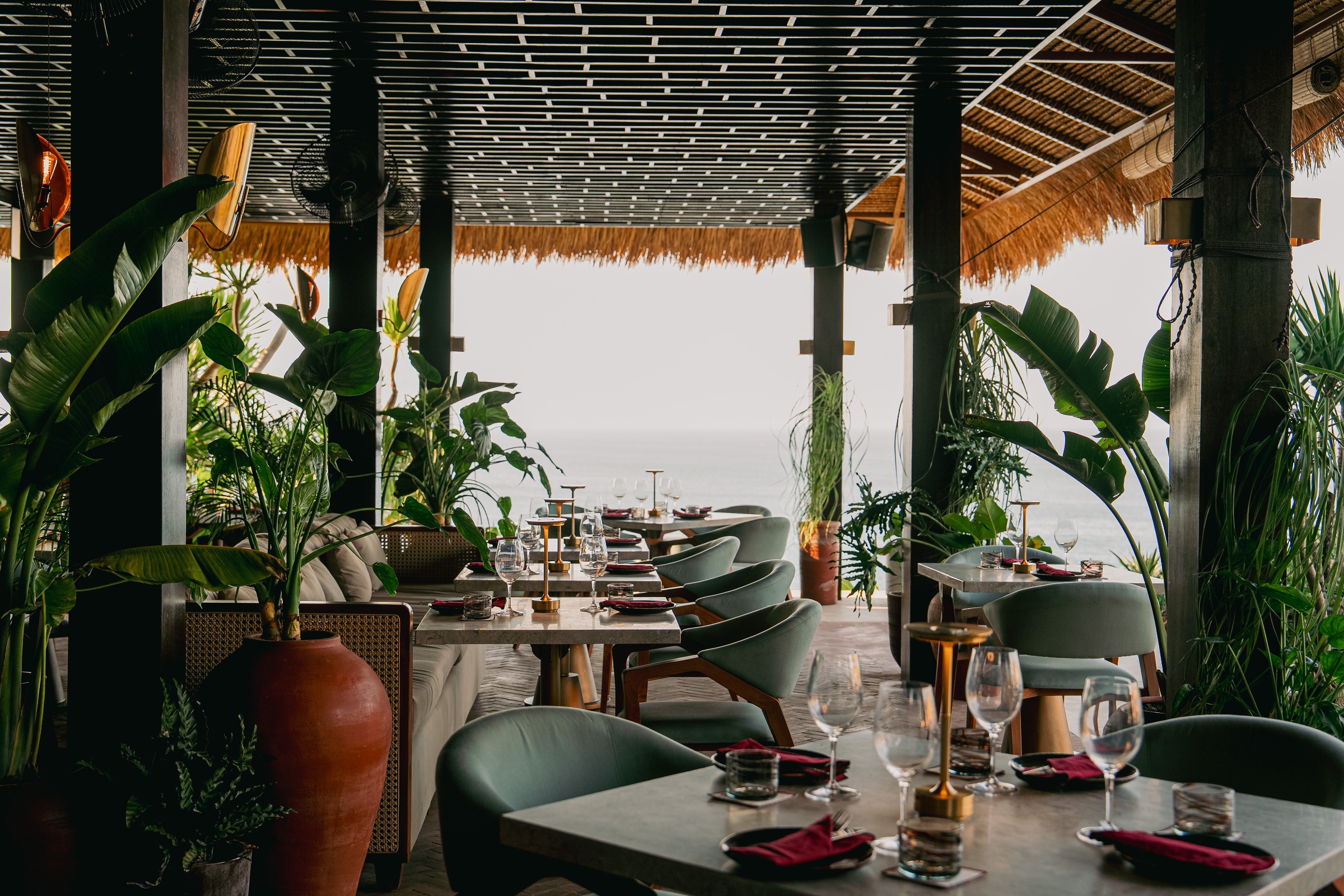Drinks being served at sunset at burnt, Ulu Cliffhouse.