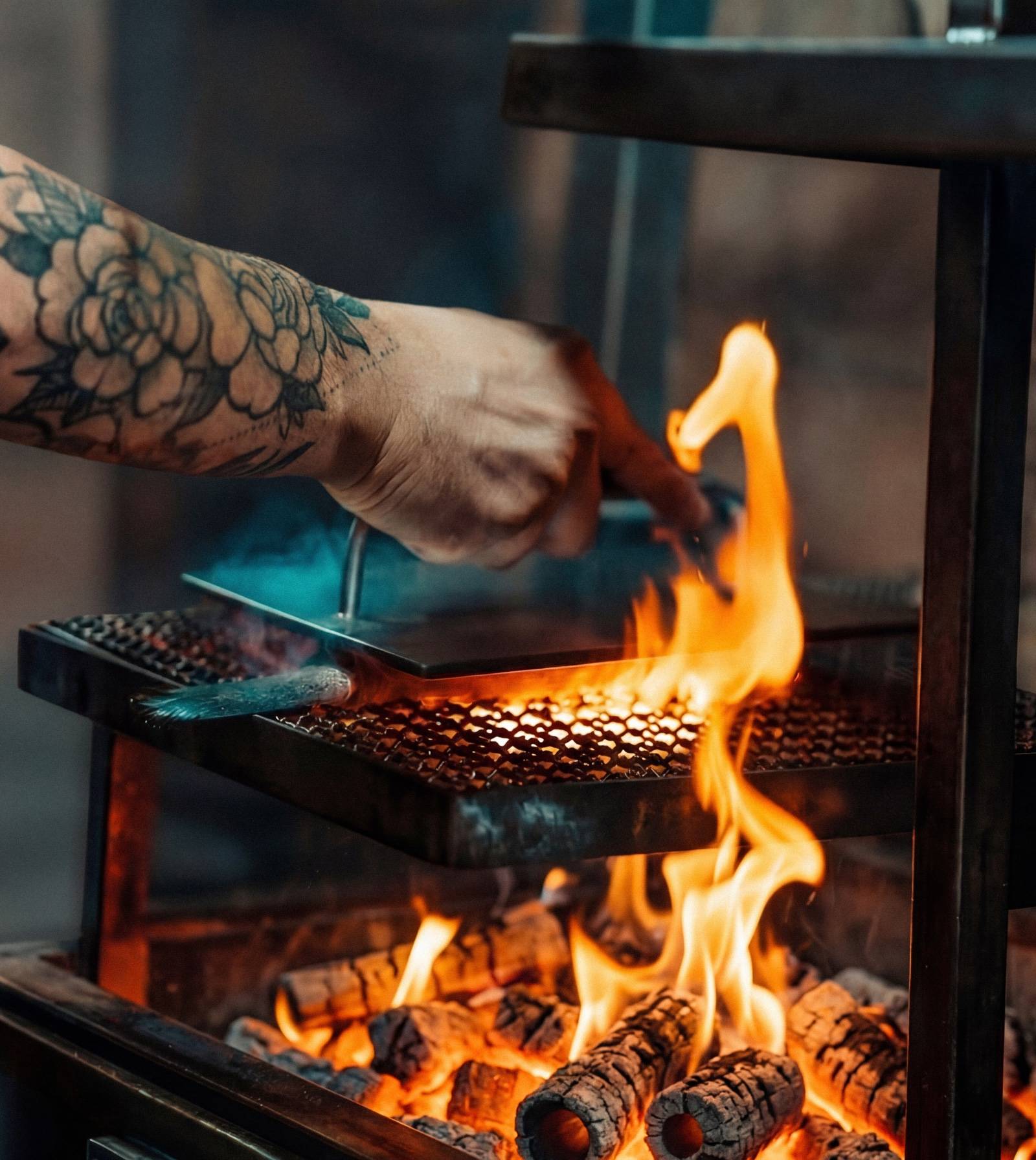 Open-fire grill and live embers at burnt, Ulu Cliffhouse in Uluwatu.